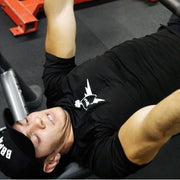 Man wearing black BBPM Flex Athletic T-Shirt shoulder benching