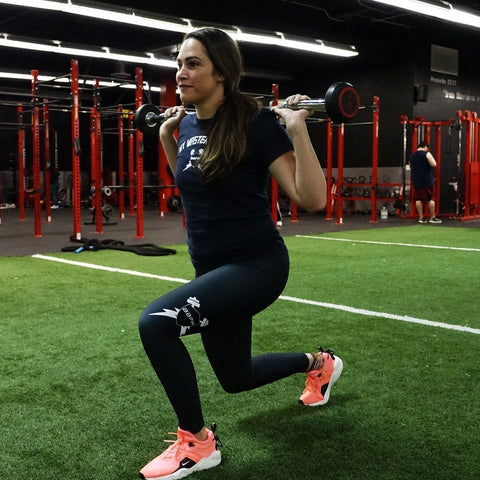 Woman lunging while wearing BBPM OG Leggings