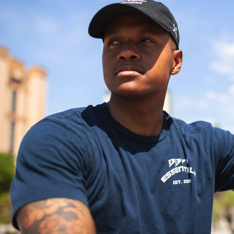 Man showing the front of the midnight navy Essentials Athletic T-Shirt