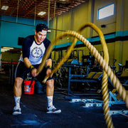 Man using battle ropes wearing the BBPM Agile Raglan Athletic T-Shirt