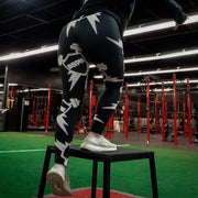 Close-up of a woman doing step-ups wearing Static Leggings